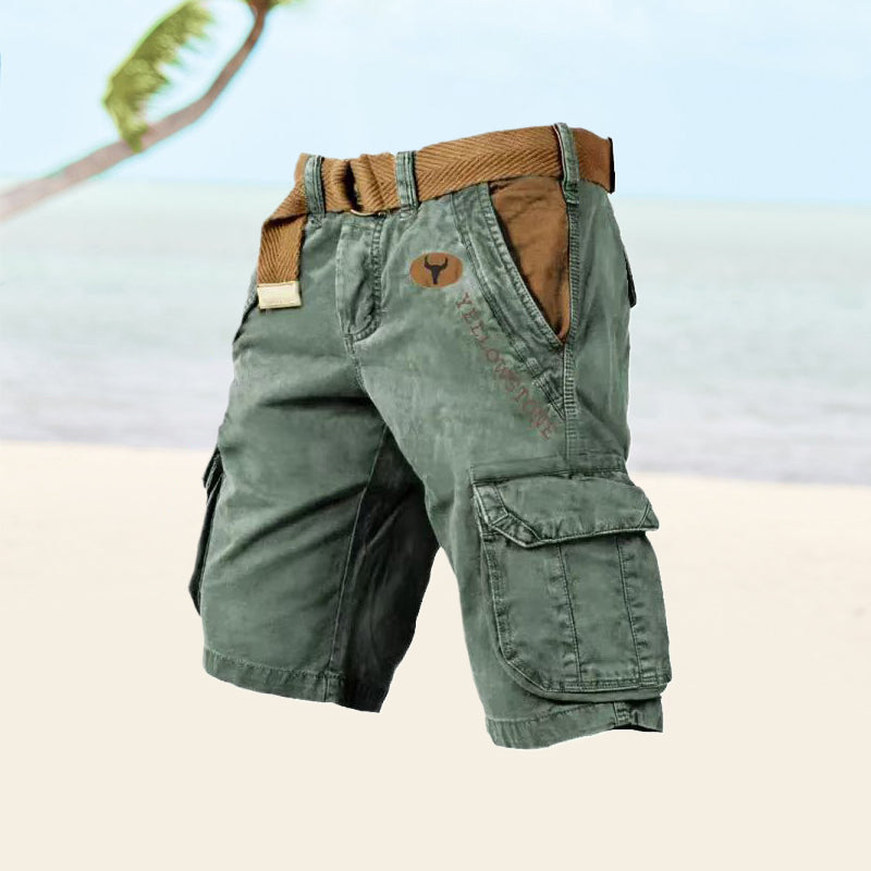 Green cargo shorts with a brown belt on a light background