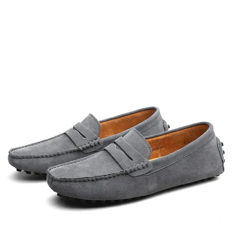 Pair of gray loafers on a white background