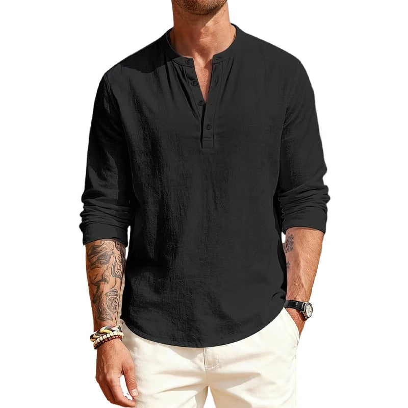 Man wearing a black long-sleeve shirt with a brand logo on a white background