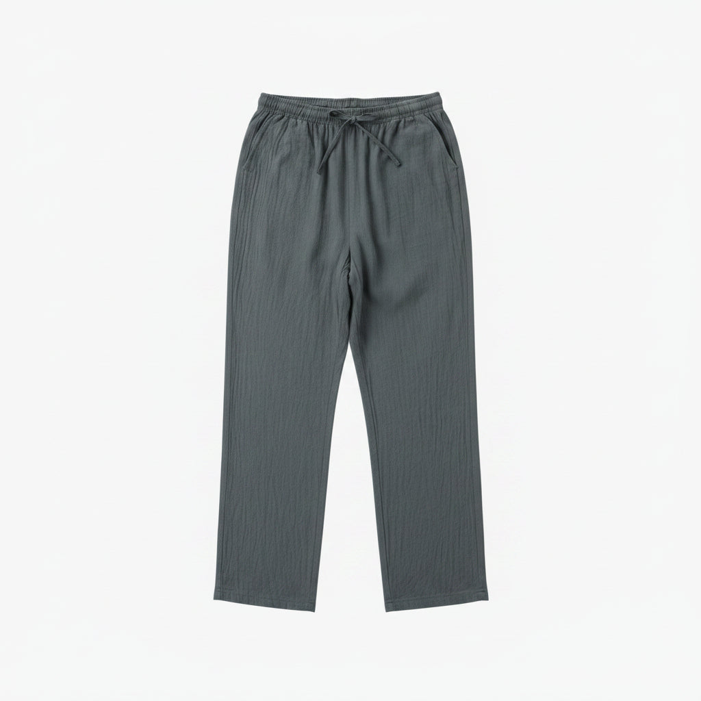 Gray pants on a hanger against a white background