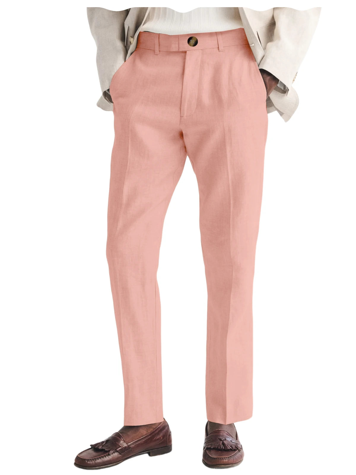 Pink dress pants worn with a white shirt and brown loafers on a white background