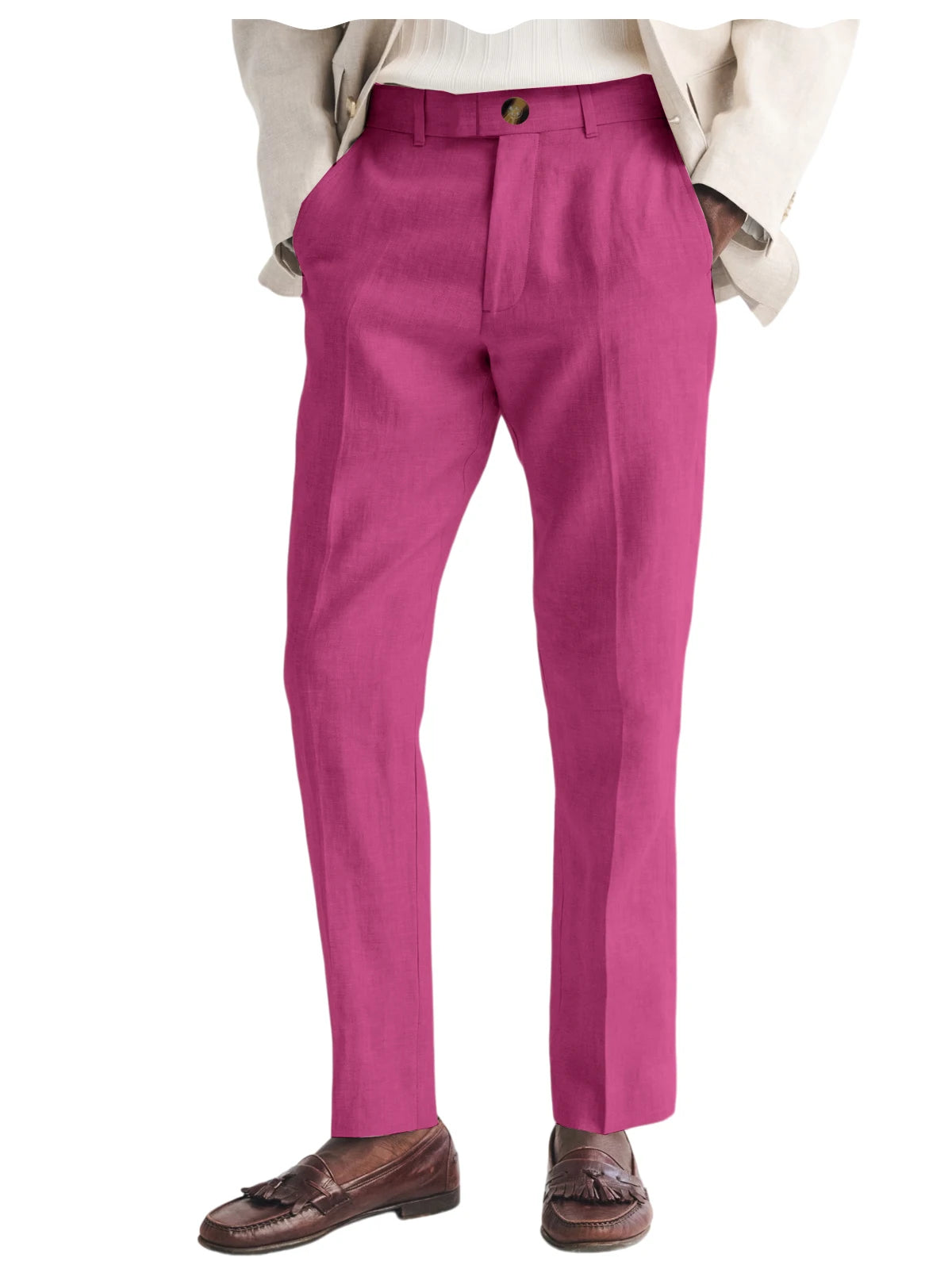 Pink trousers worn with a beige jacket and brown shoes on a white background