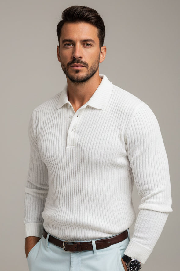 Man wearing a white ribbed sweater with a blurred background