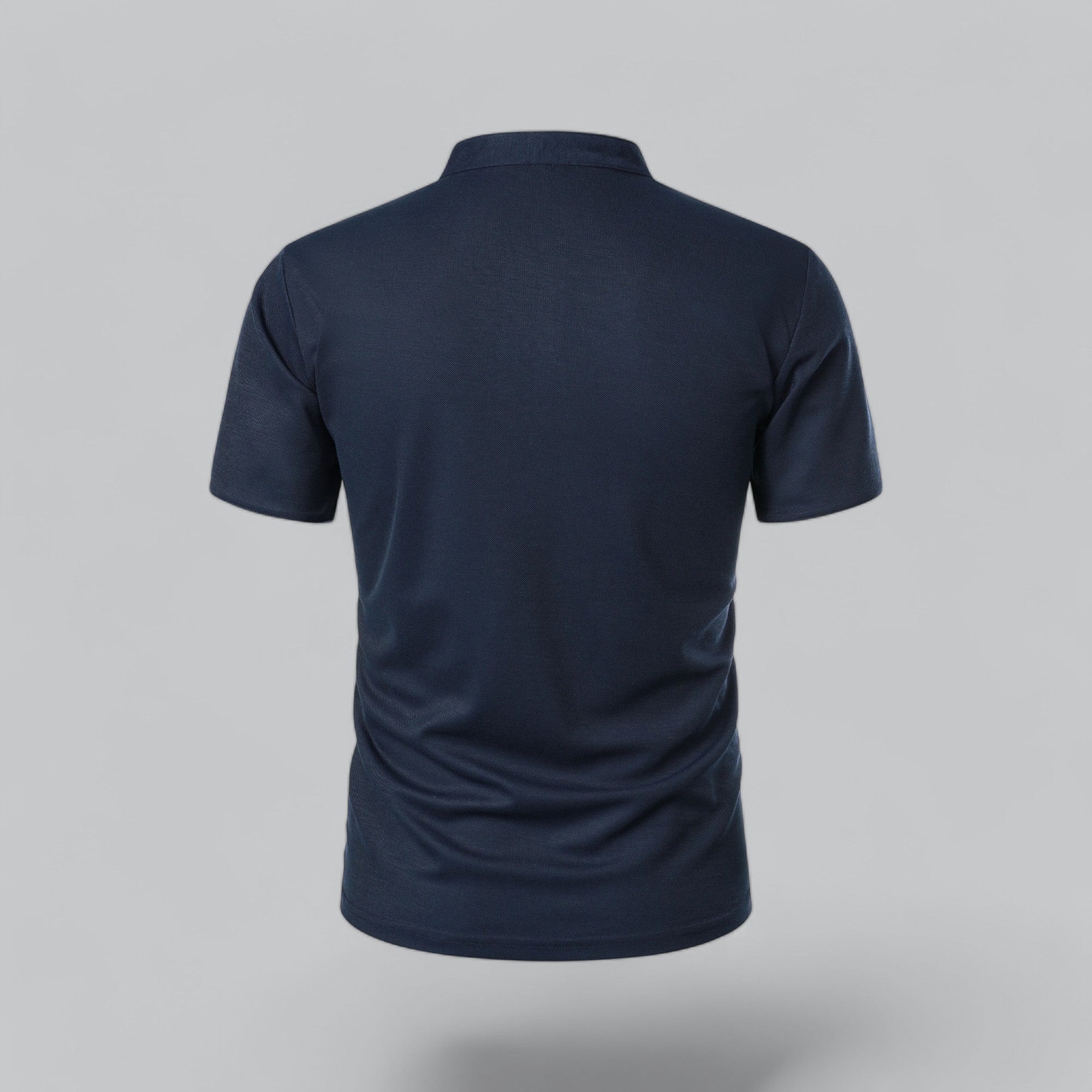 Navy blue polo shirt on a gray background