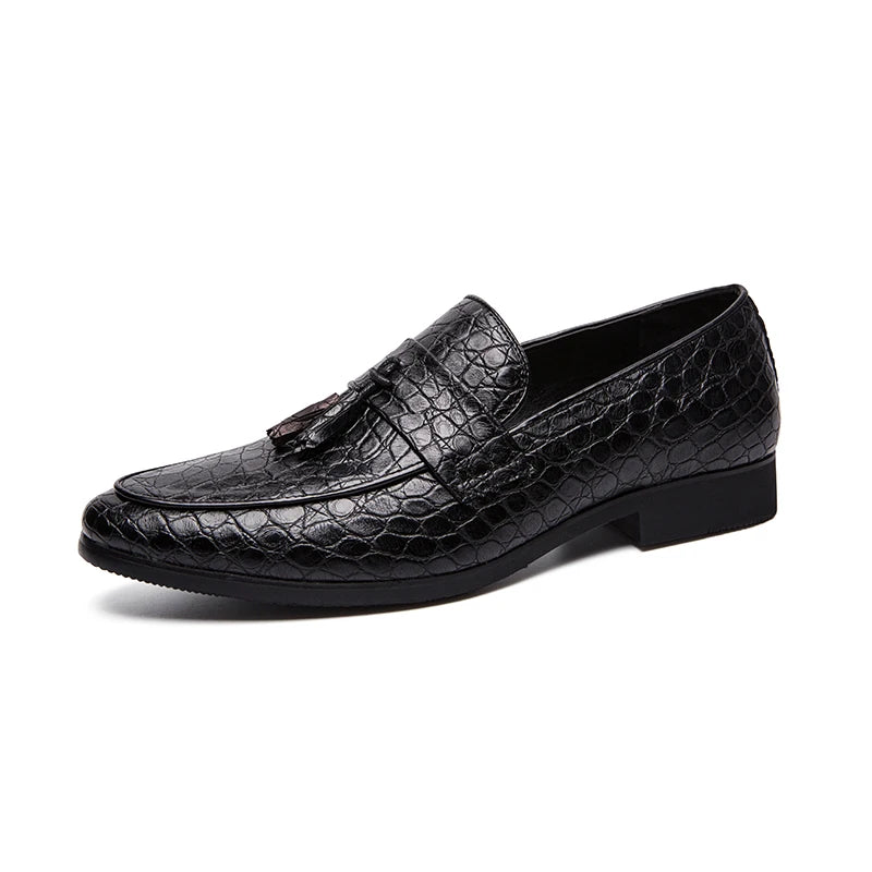Black leather loafer with tassel on a white background