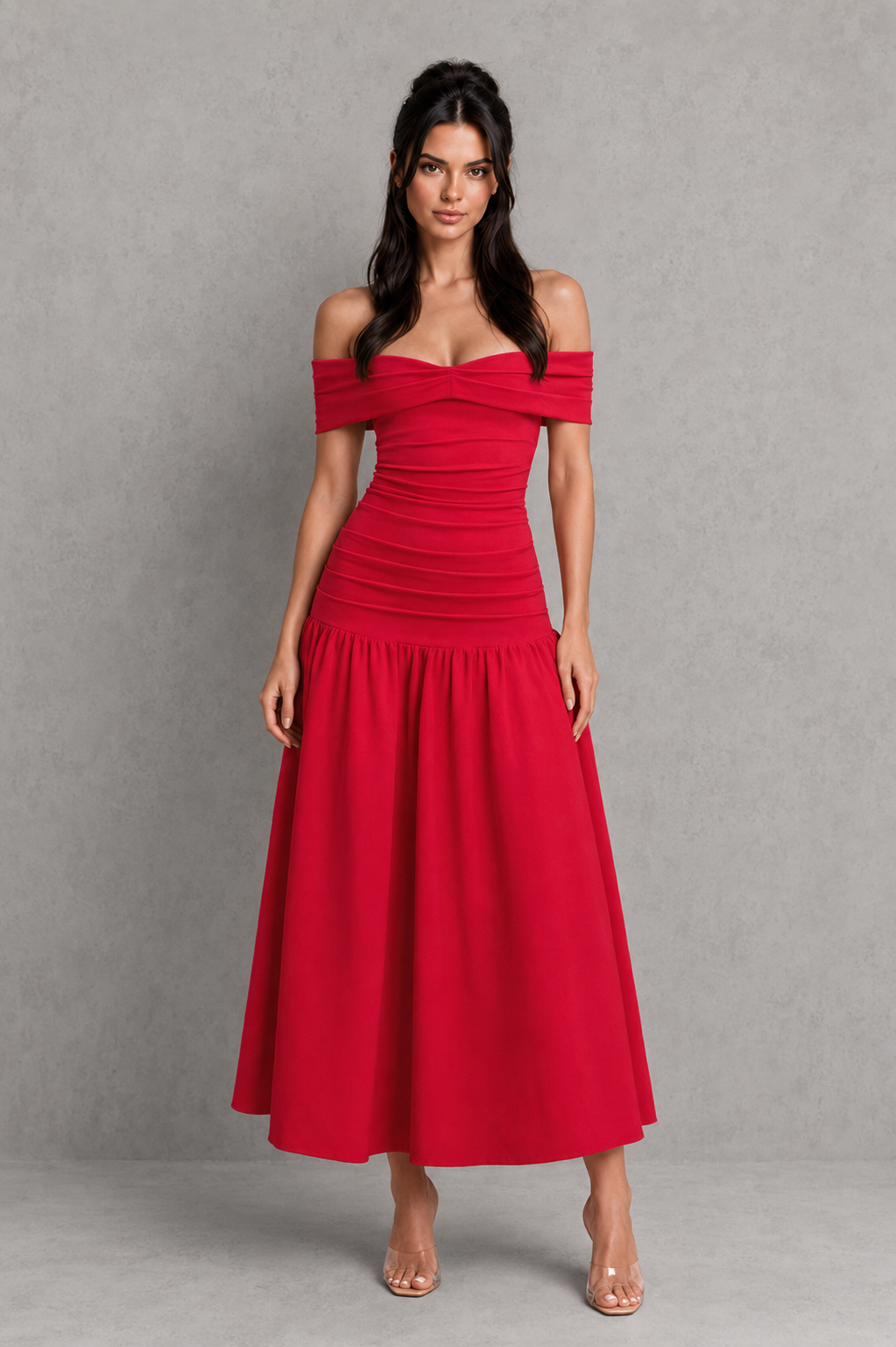Woman wearing a red off-shoulder dress against a gray background