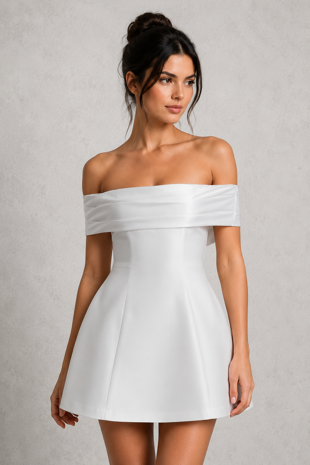 Woman wearing a white off-shoulder dress against a plain background