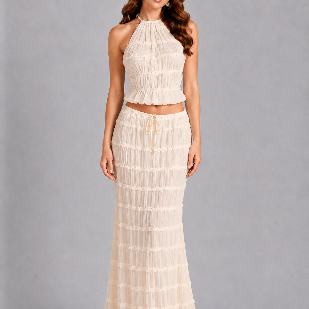 Woman wearing a white dress against a gray background
