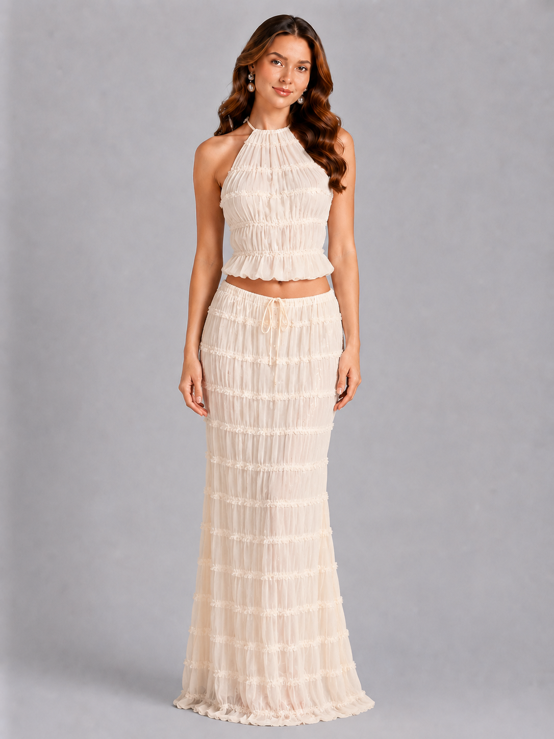 Woman wearing a white dress against a gray background
