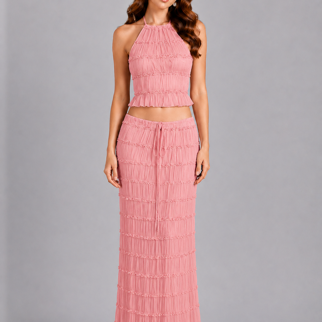 Woman wearing a pink dress with a gray background