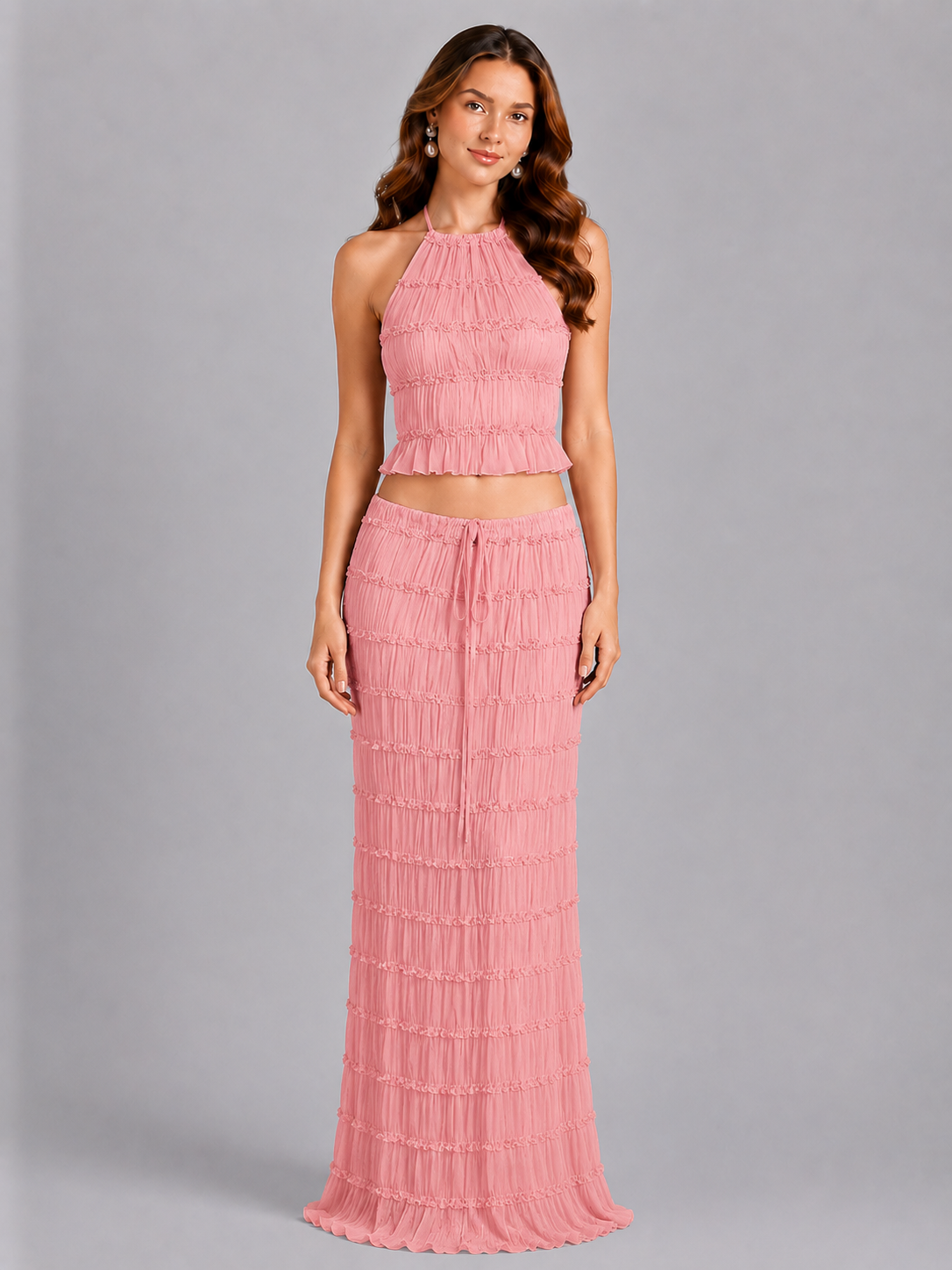 Woman wearing a pink dress with a gray background