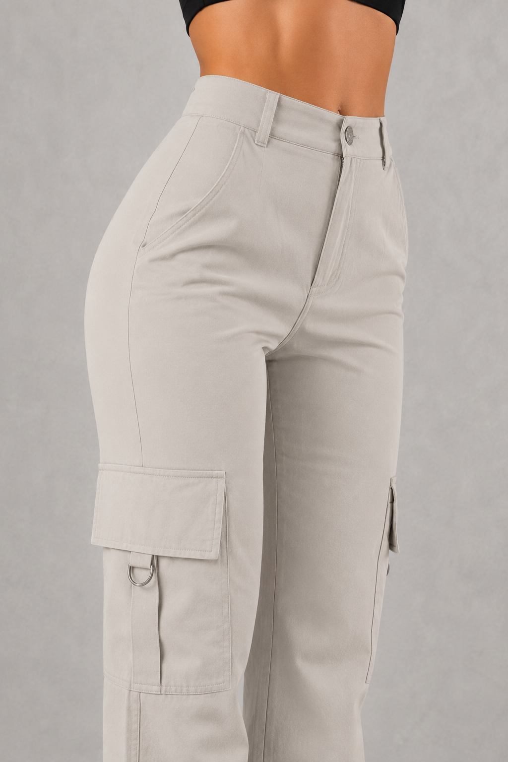 Beige cargo pants on a gray background