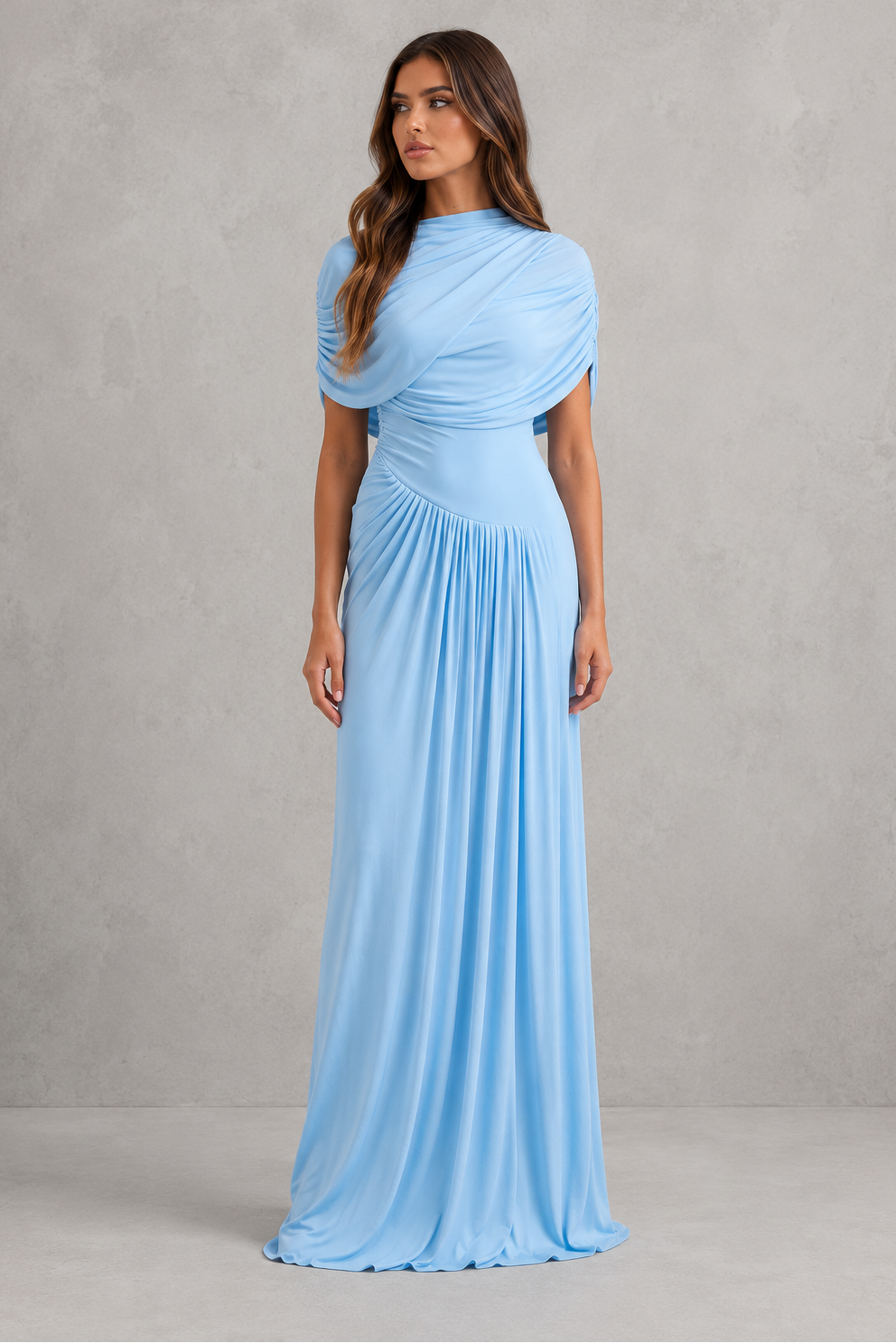 Woman wearing a light blue evening gown against a gray background