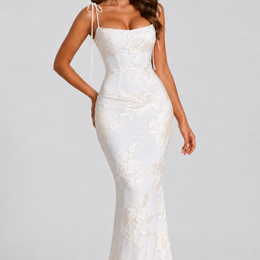 Woman wearing a white lace dress on a gray background