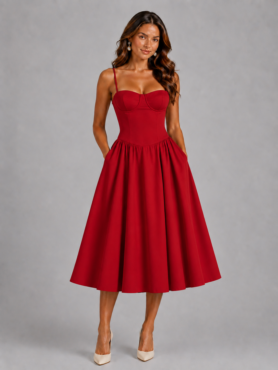 Woman wearing a red dress against a gray background
