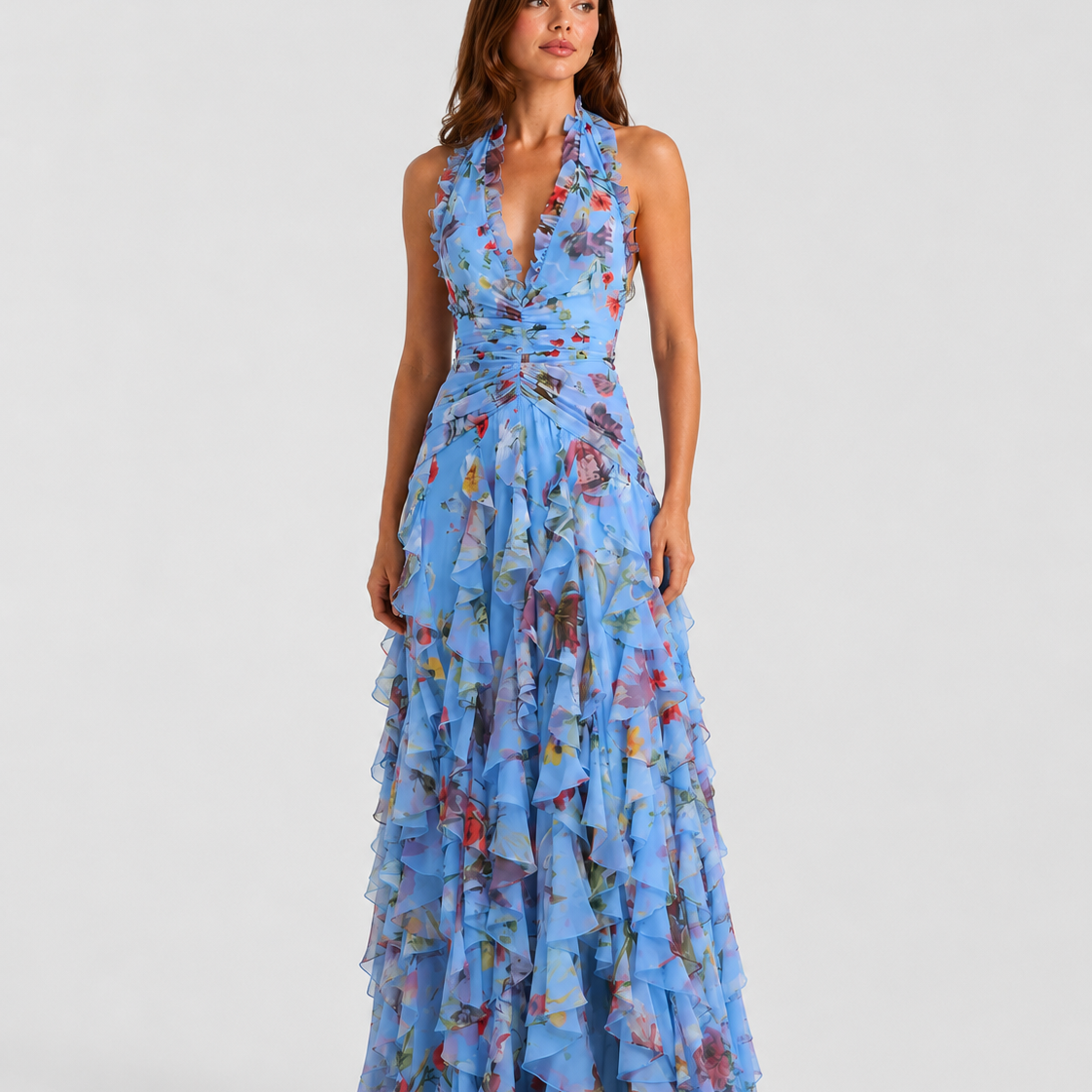 Woman wearing a blue floral dress on a white background