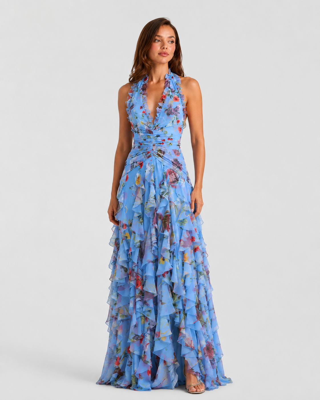 Woman wearing a blue floral dress on a white background