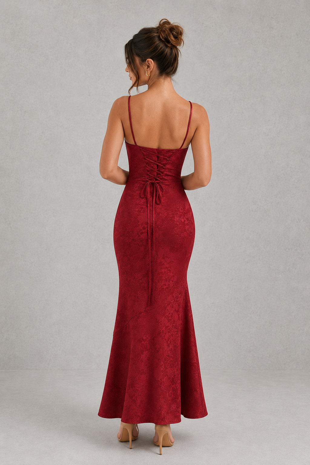 Red evening gown with open back on a gray background