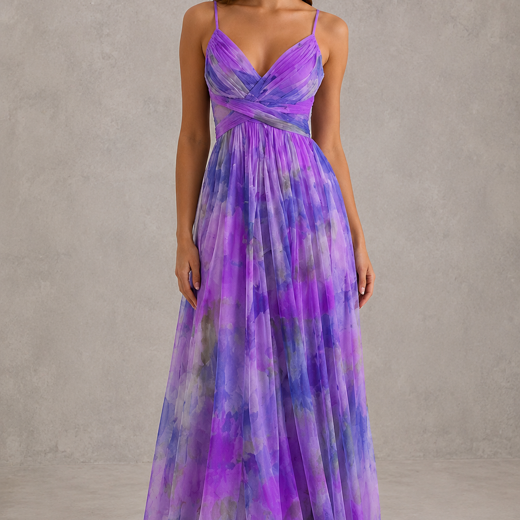 Woman wearing a purple and blue gradient evening gown against a neutral background