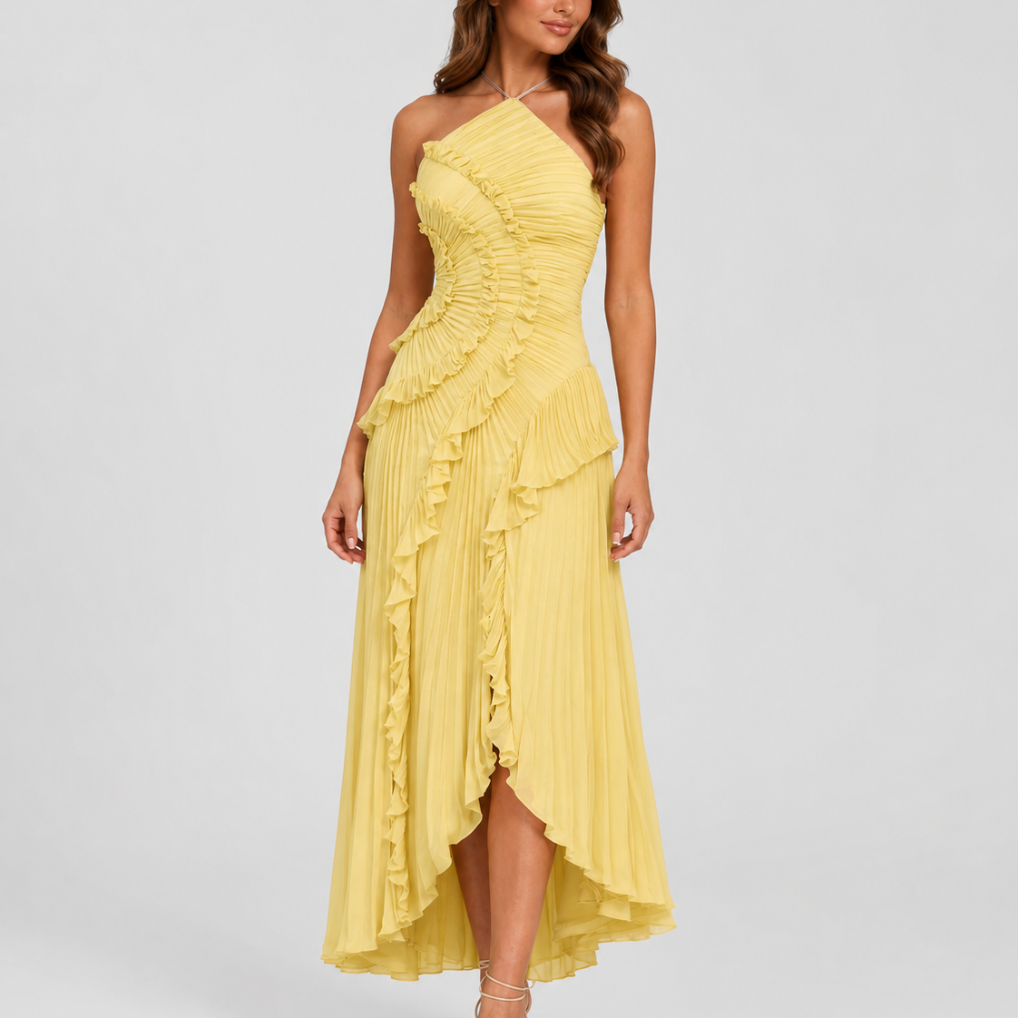 Woman wearing a yellow one-shoulder dress on a white background