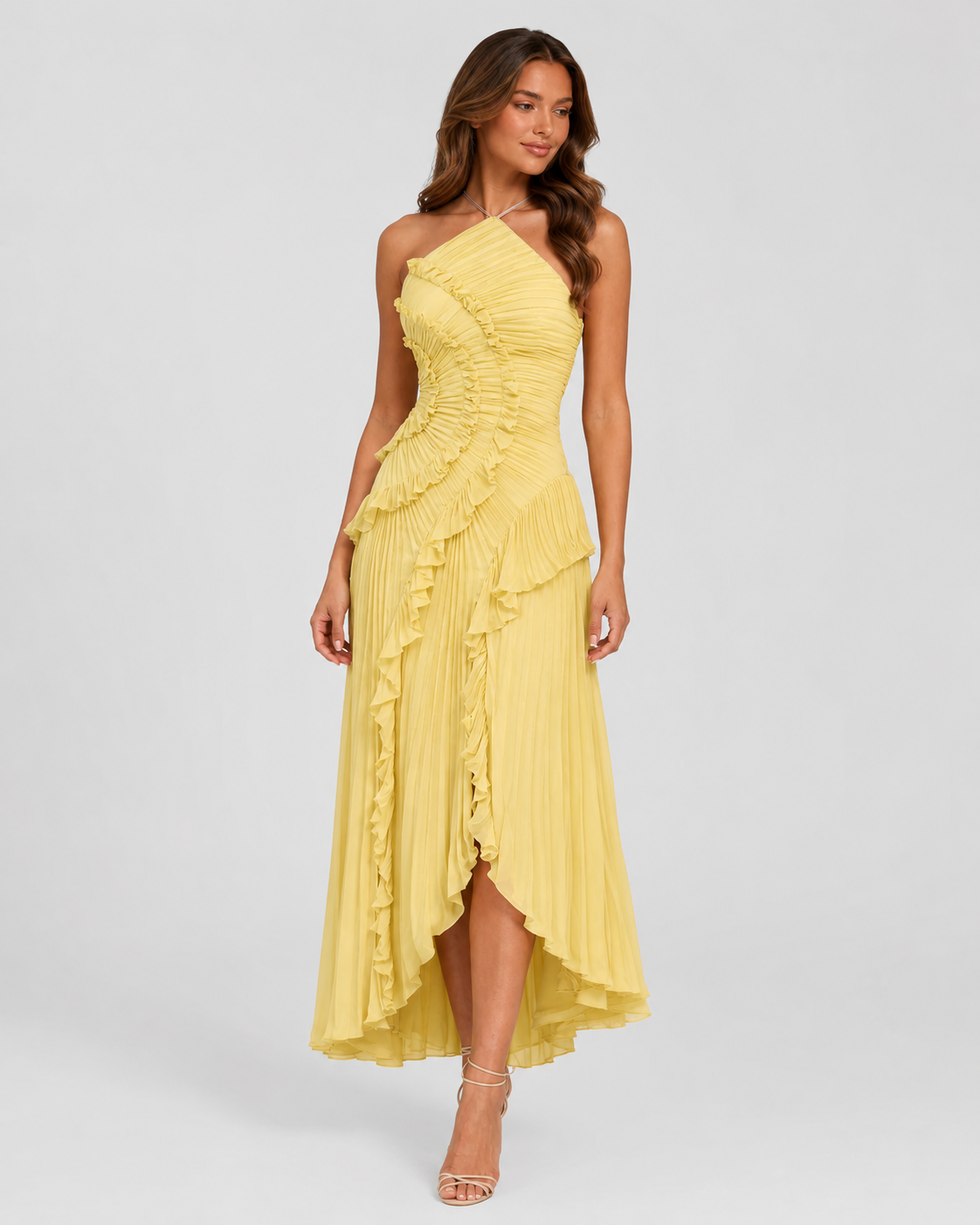 Woman wearing a yellow one-shoulder dress on a white background