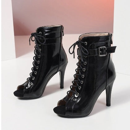 Black high-heeled peep-toe boots with lace-up design on a white background