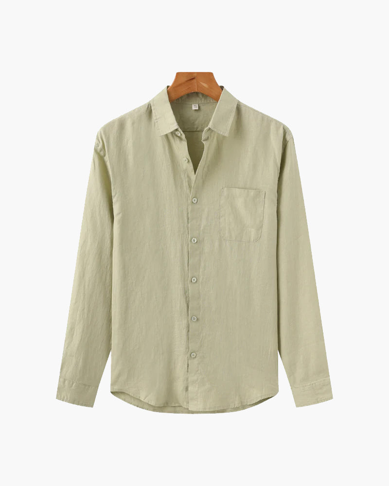 Beige button-up shirt on a hanger against a white background