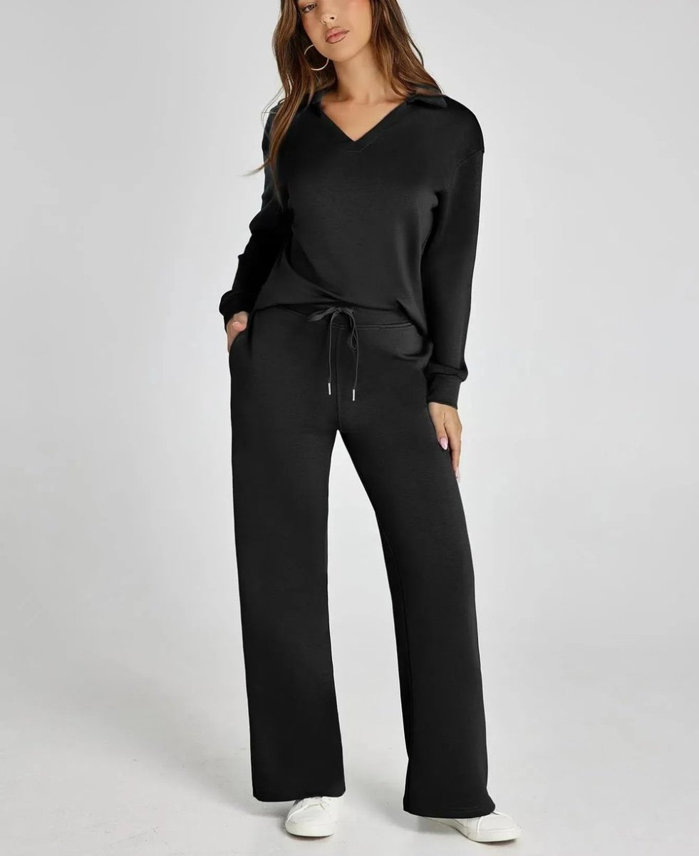 Woman wearing a black outfit with a white background