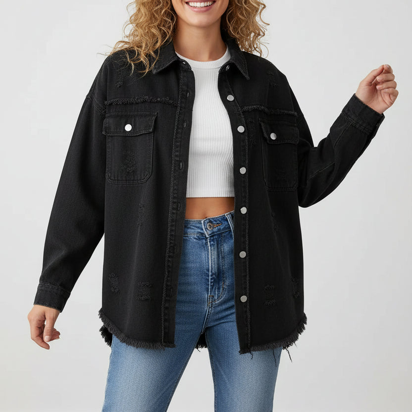 Woman wearing a black denim jacket and blue jeans on a white background