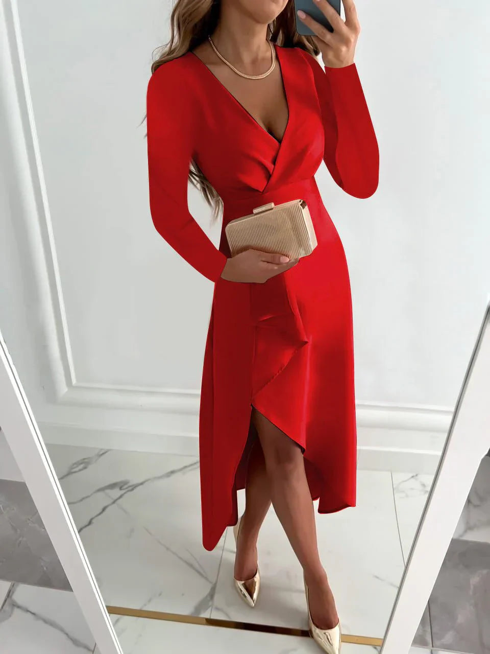 Woman wearing a red dress with a white wall background