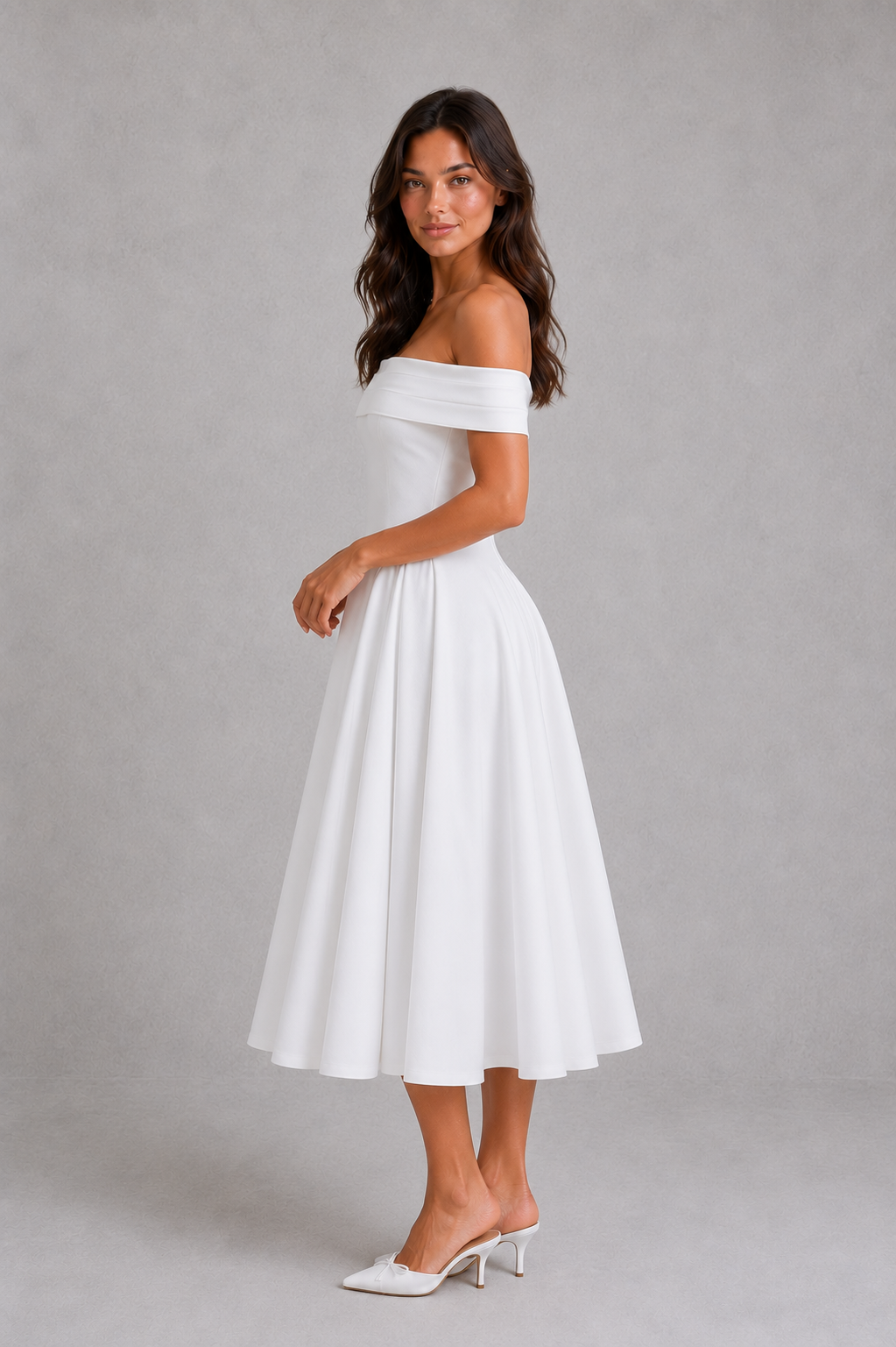 Woman wearing a white off-shoulder dress against a gray background