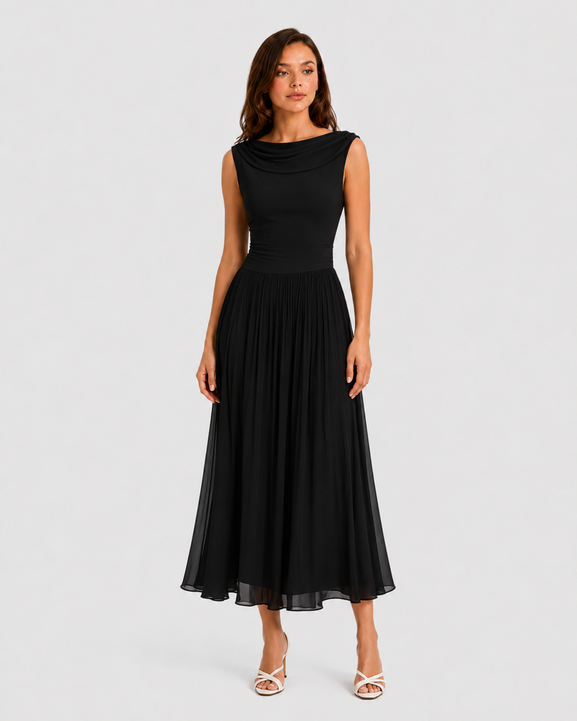 Woman wearing a black dress on a white background