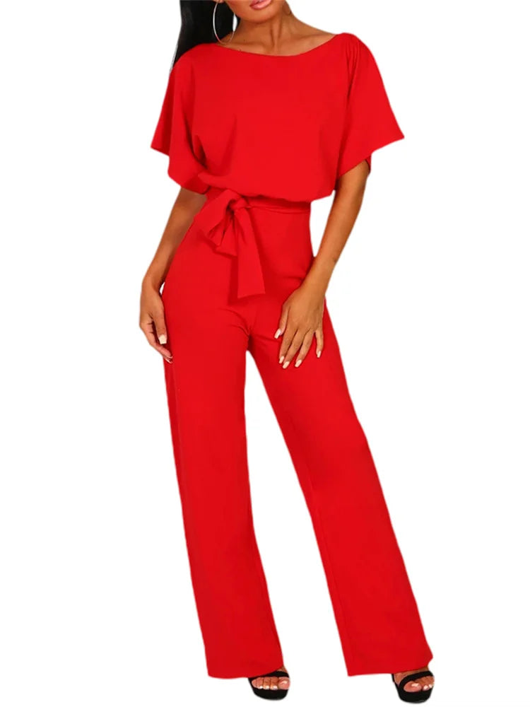 Red jumpsuit worn by a model on a white background