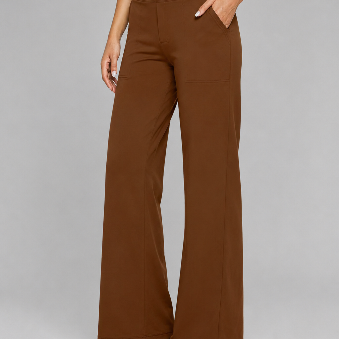 Brown wide-leg pants worn by a person on a gray background