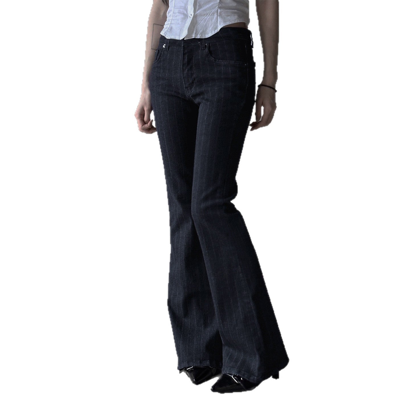 Black flared pants worn by a person on a white background