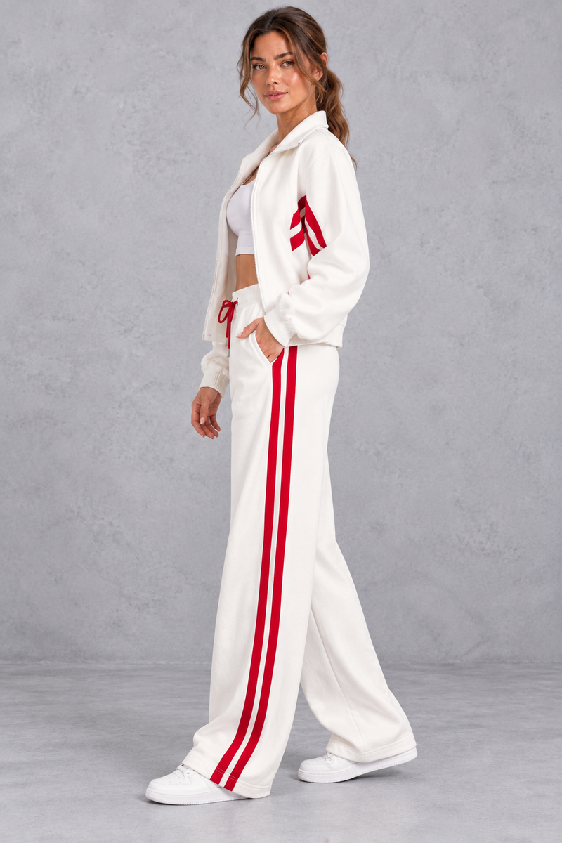 Women's white zip-up tracksuit set with wide leg striped joggers – side view