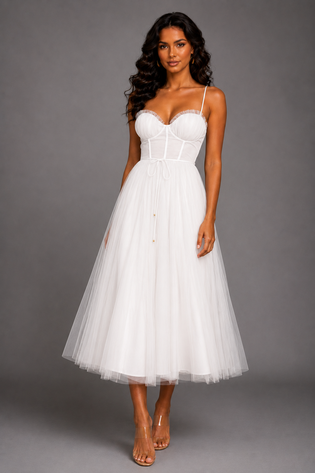 Woman wearing a white dress against a gray background