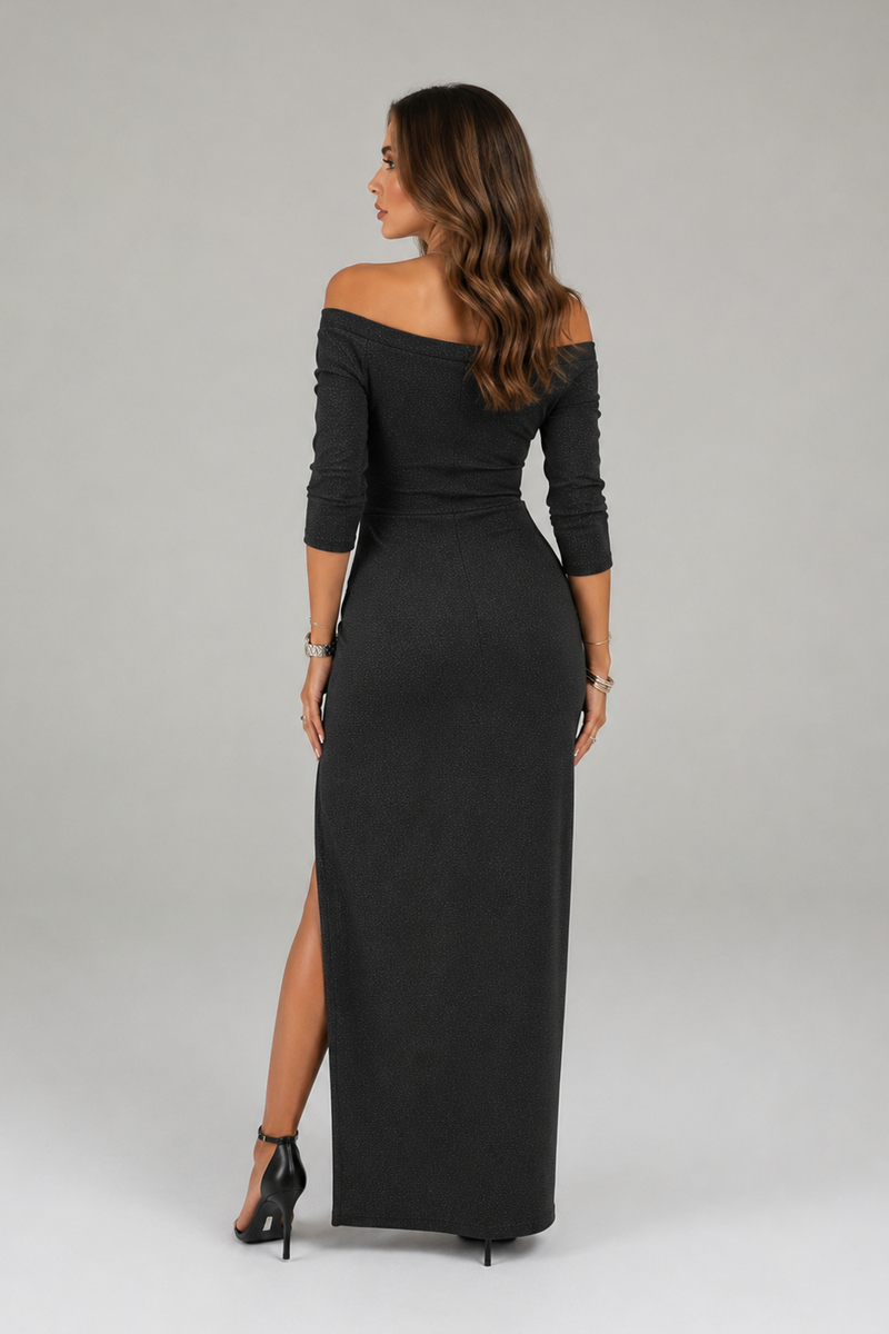 Woman wearing a black off-shoulder dress with a slit on a gray background