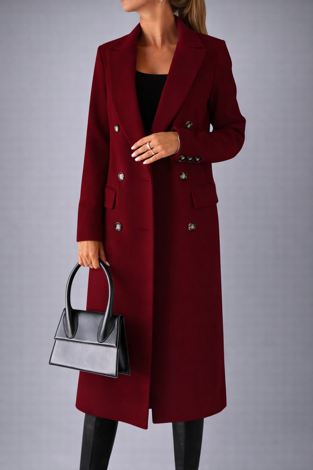 Red coat worn by a person on a gray background