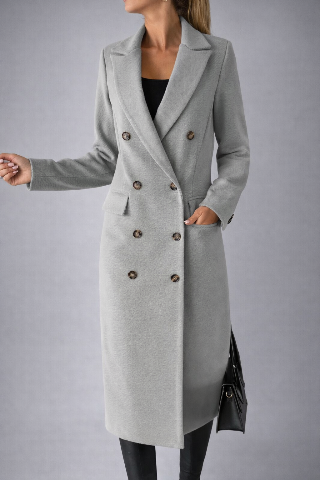 Gray coat worn by a person on a gray background