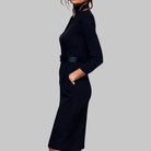 Black dress worn by a person on a gray background