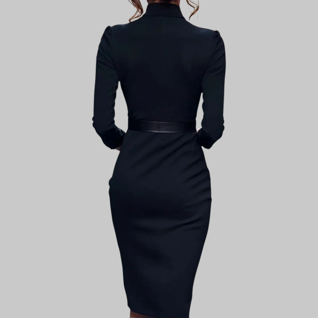 Black dress with a belt on a gray background
