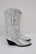 Women’s Western high boots in silver with pointed toe and cowboy detailing, stylish and comfortable for casual and festival outfits.1