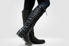 Women’s black leather high boots with cosy lining and non-slip sole, stylish and comfortable for autumn and winter.