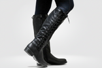 Women’s black leather high boots with cosy lining and non-slip sole, stylish and comfortable for autumn and winter.