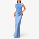 Women’s asymmetric maxi dress in blue with delicate pleats, flowing and elegant for weddings and formal events.