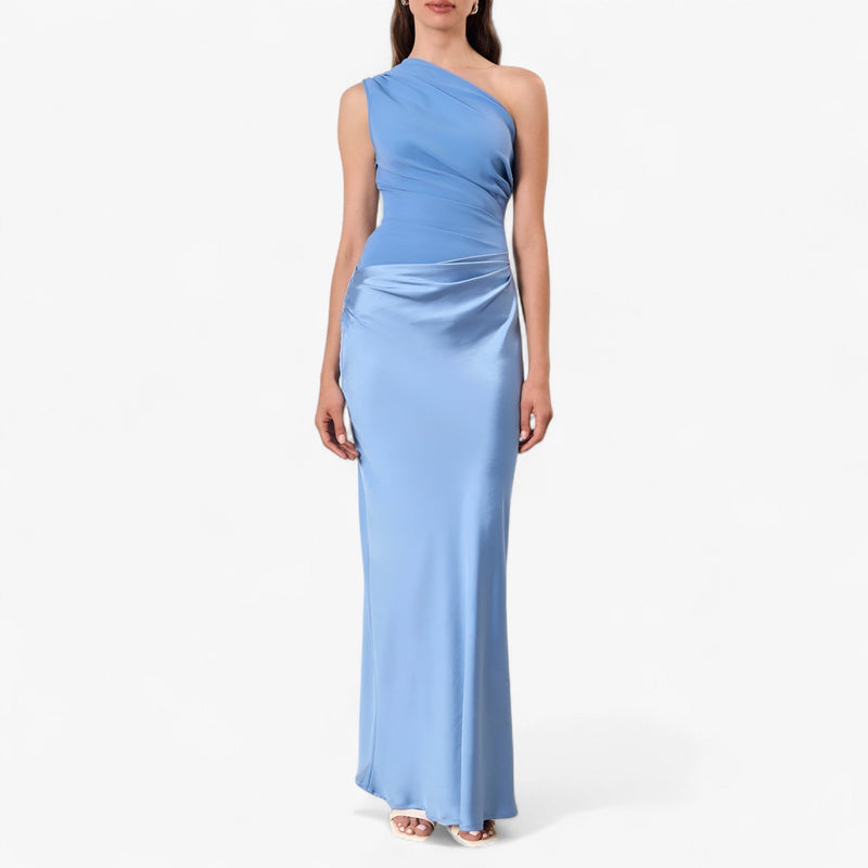 Women’s asymmetric maxi dress in blue with delicate pleats, flowing and elegant for weddings and formal events.1