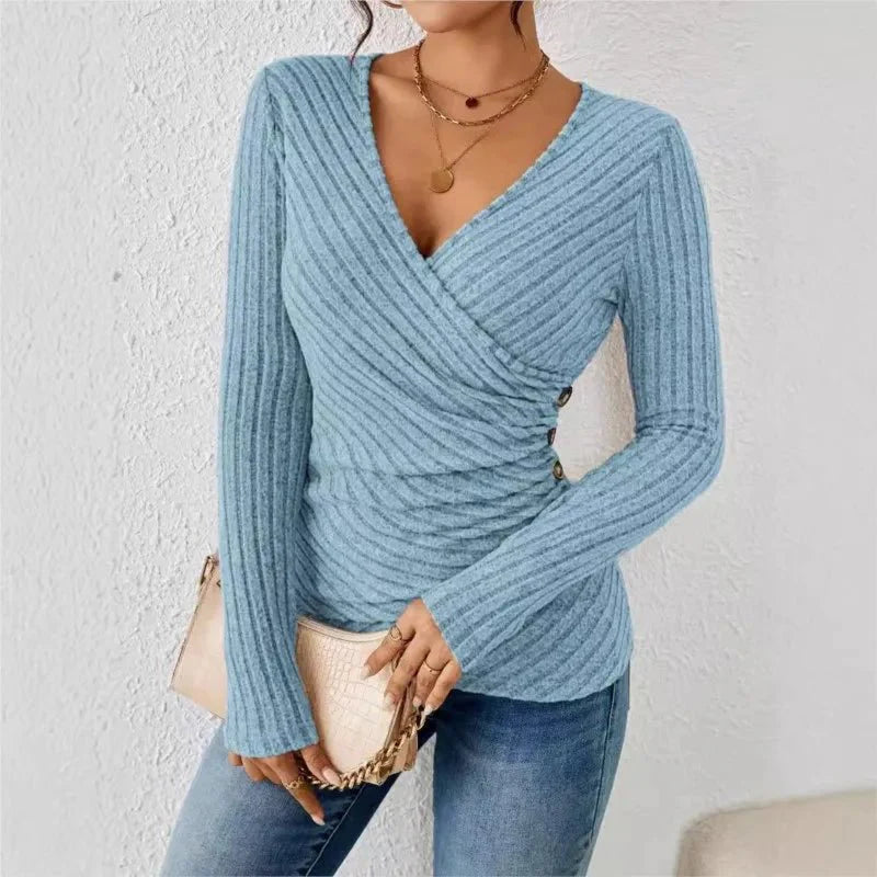 Women’s blue tummy-tucking long sleeve V-neck top with flattering silhouette and stretch comfort.