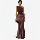 Women’s asymmetric maxi dress in brown with delicate pleats, flowing and elegant for weddings and formal events.