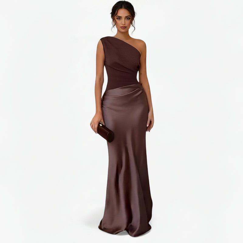 Women’s asymmetric maxi dress in brown with delicate pleats, flowing and elegant for weddings and formal events.